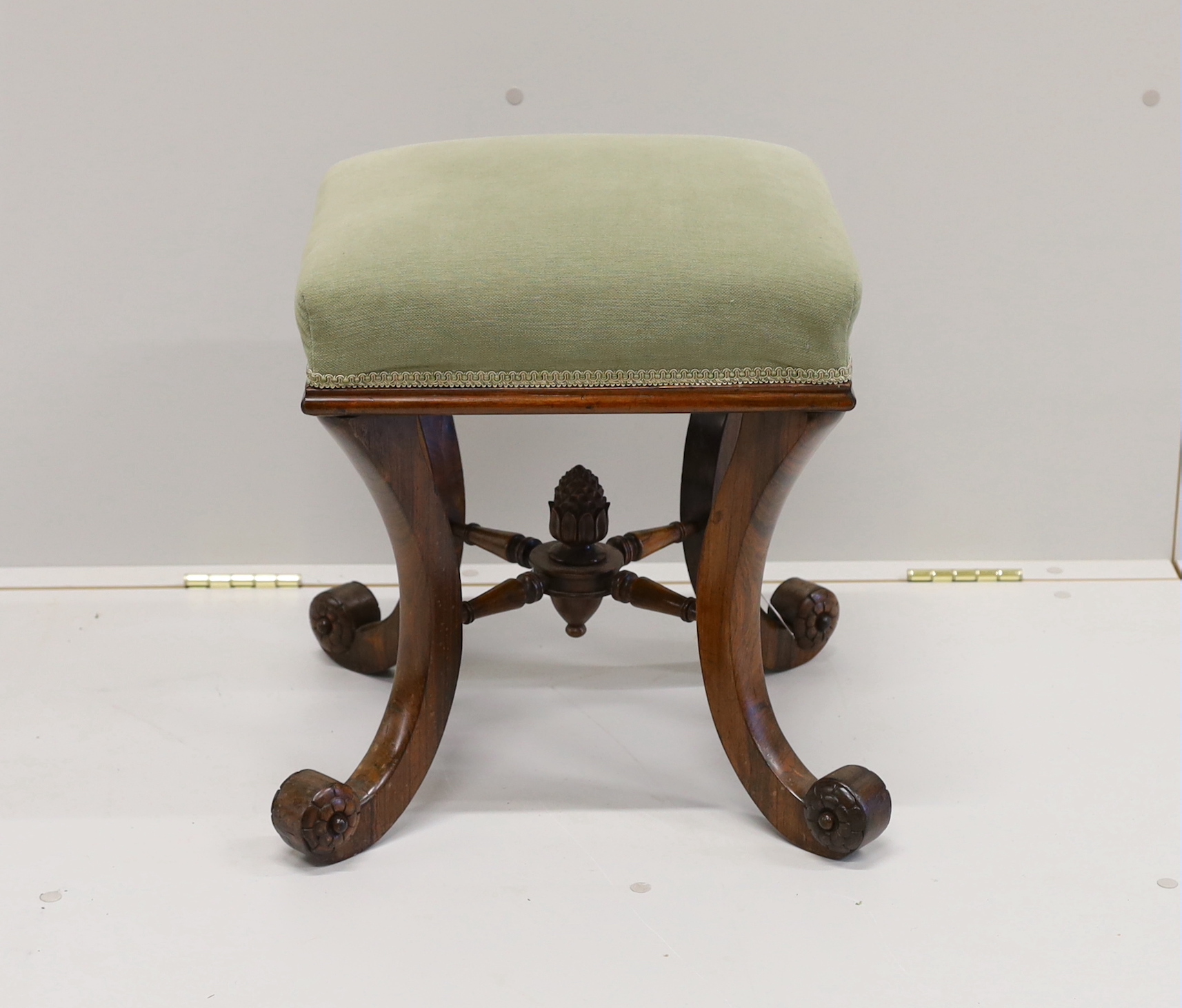 A Victorian rosewood dressing stool on scrolled supports, width 46cm, height 48cm